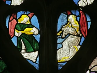Window depicting musical angels with shawm and lute